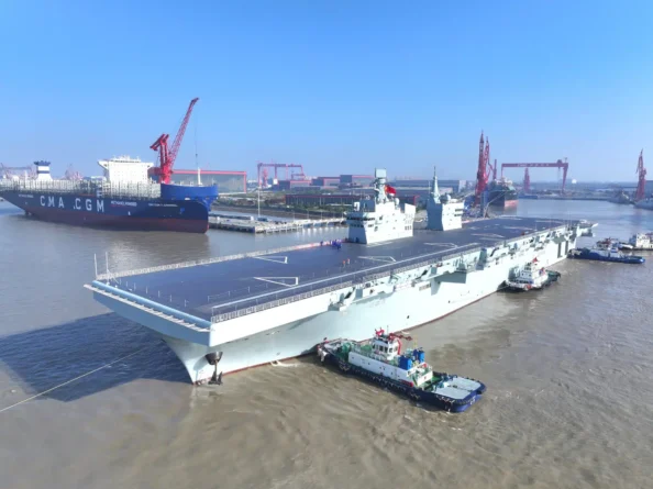 Type 076 amphibious assault carrier Sichuan (31) leaving her berth assisted by tugs earlier today in Shanghai. Image Chinese state media.