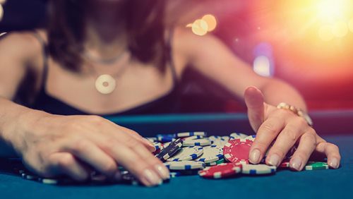 female player checking how much winning casino poker game[1]