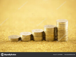 depositphotos 251848065 stock photo rising golden coins on golden