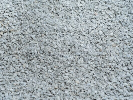 white granite gravel stones flooring pattern surface texture. close up of exterior material for design decoration background