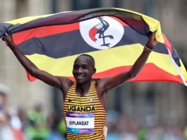 victor kiplangat with the uganda national flag1
