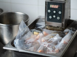 professional meat cooker machine cooking chicken meat in vacuum