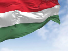 the national flag of hungary fluttering in the wind on a clear day