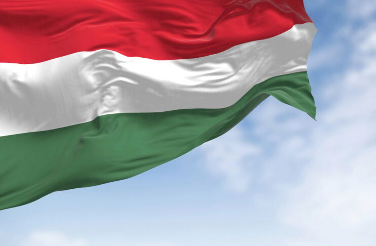 the national flag of hungary fluttering in the wind on a clear day